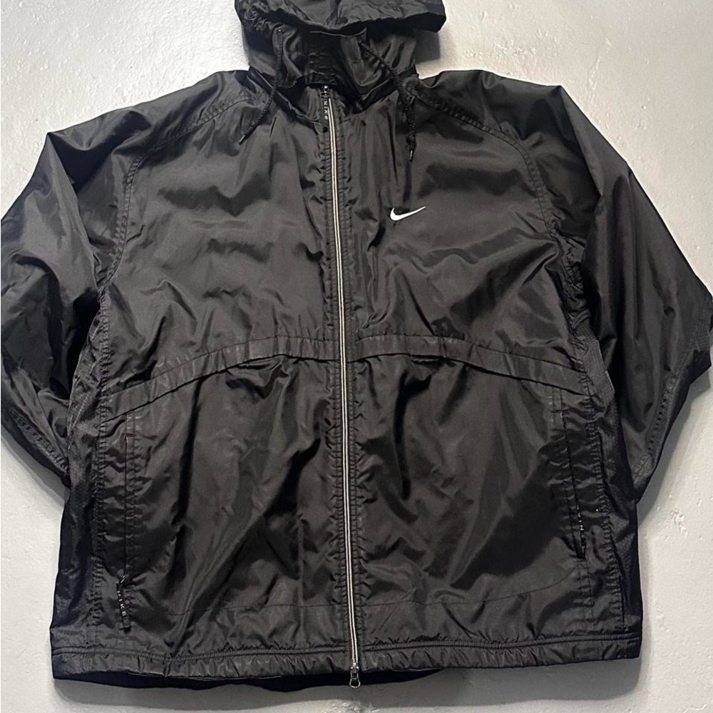 Vintage Nike jacket in black with a grey inner lining
